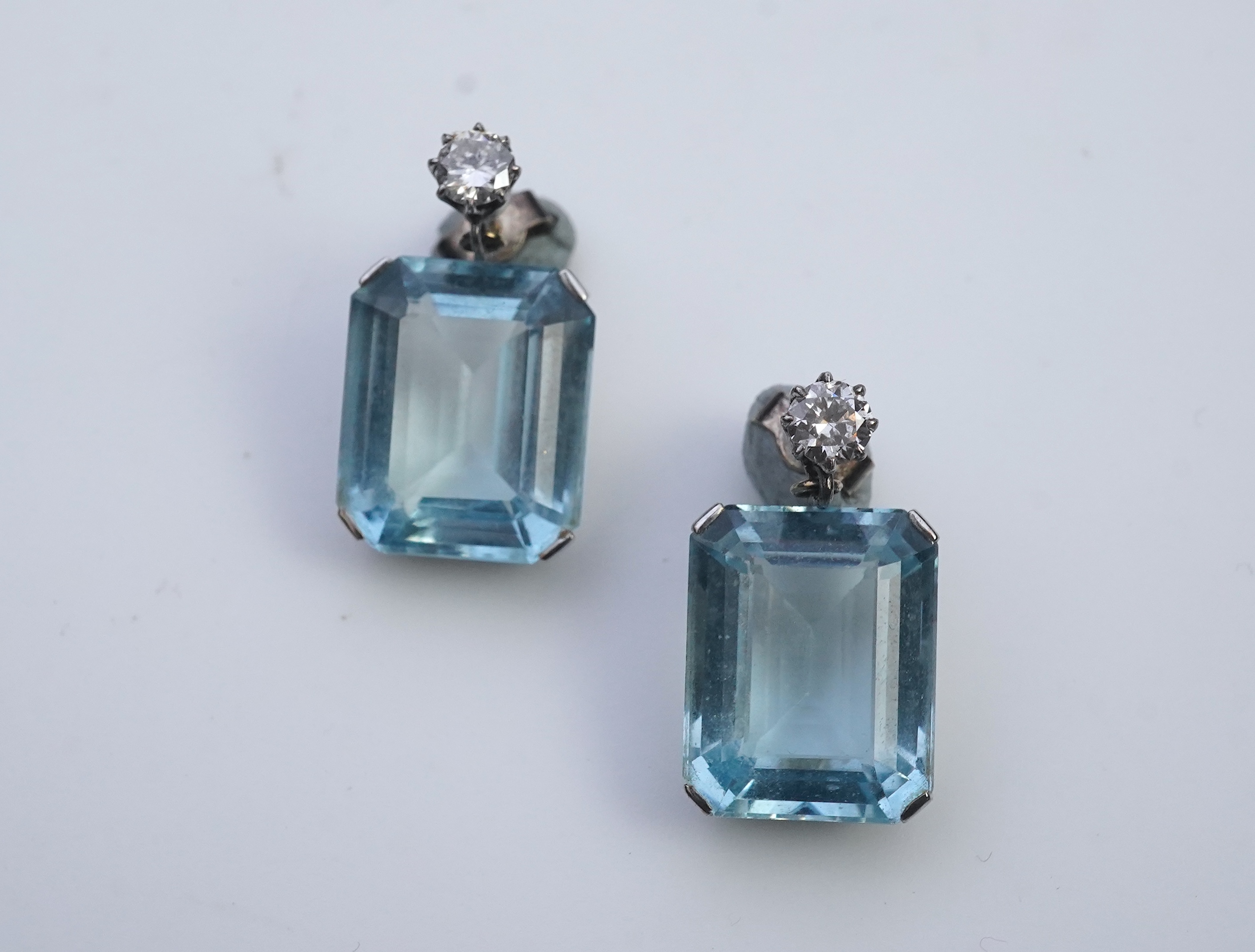 A pair of aquamarine and diamond earrings